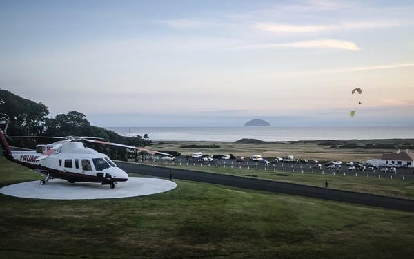 Donald Trump was greeted by Greenpeace when he landed at his Scottish golf course