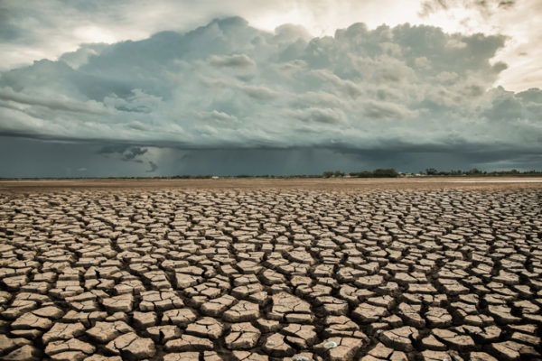 Rainstorms falling on dry, cracked ground