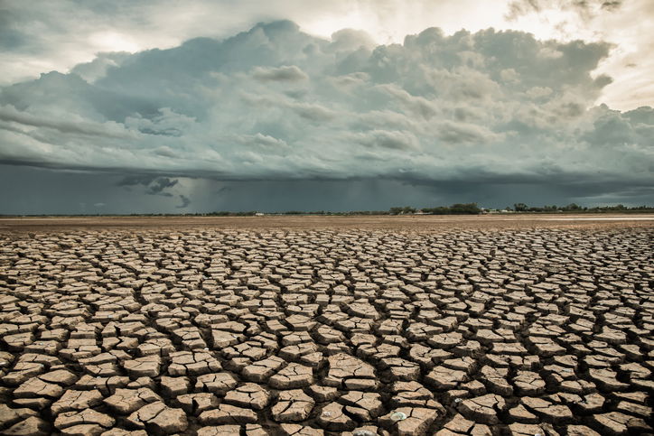Rainstorms falling on dry, cracked ground