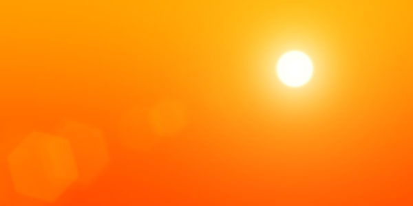The sun on a background of orange sky