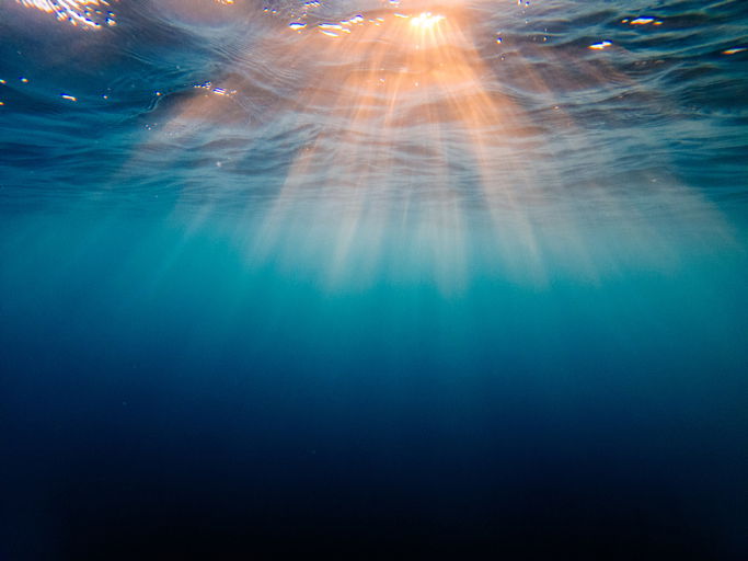 Sunset sunbeam under water