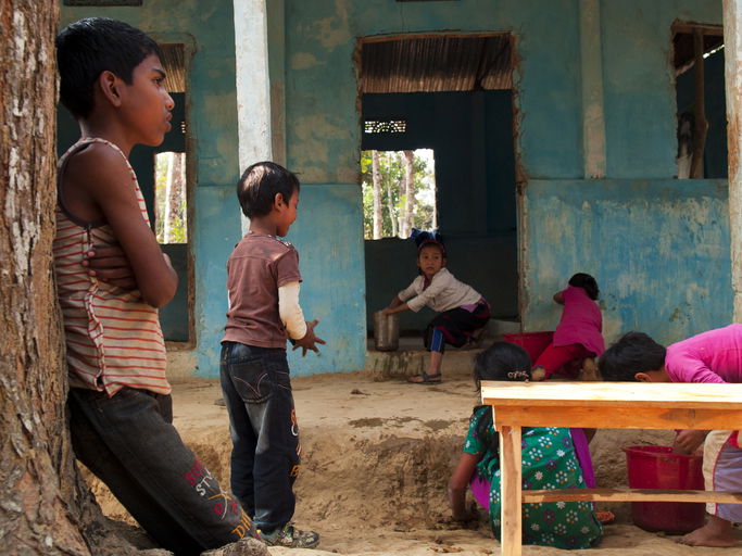 Group of children playing in front of the school entrance in one of the tribal village (Khashia tribe) near Srimangal