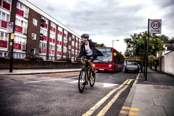 Cyclist commuter wearing a pollution-mask in Central London
