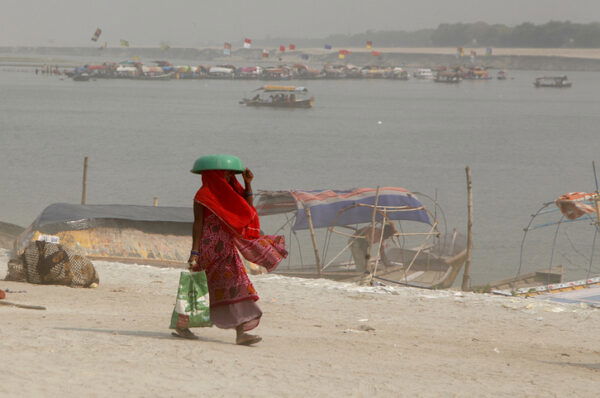 Indians brave the heat wave at the bank of Sangam, the confluence of Holy river Ganges , Yamuna and mythical Saraswati during the hot summer day in Prayagraj, India