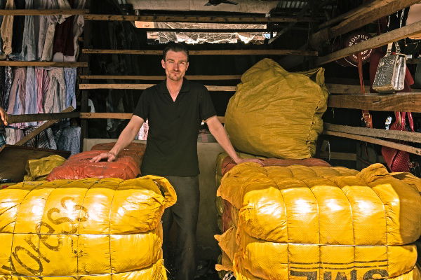 with imported textile waste in Kantamanto Market, Accra